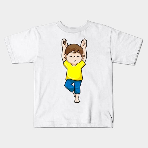 Boy at Yoga Stretching exercises Kids T-Shirt by Markus Schnabel